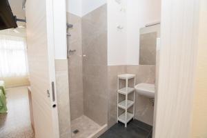 a bathroom with a shower and a sink at Residence Daniele in Bellaria-Igea Marina