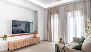 a living room with a flat screen tv on a wall at Myflats Luxury Cathedral in Alicante