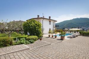 a villa with a swimming pool and a resort at Ca' Le Terrazze With Pool in Garda