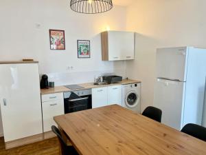 Kuchyň nebo kuchyňský kout v ubytování Appartement Victor Hugo - balcon + 20 fotografií