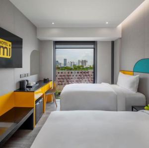 Postel nebo postele na pokoji v ubytování Hotel Mi Rochor