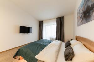 Ένα ή περισσότερα κρεβάτια σε δωμάτιο στο Luxury Apartments Uzhorod