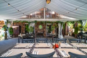 a marquee with tables and chairs in a restaurant at Angel Sussurri in Yarramalong