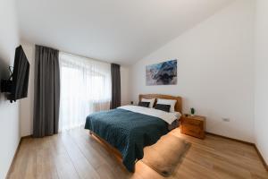 Ένα ή περισσότερα κρεβάτια σε δωμάτιο στο Luxury Apartments Uzhorod