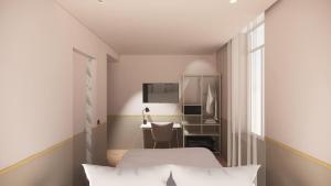 1 dormitorio con 1 cama y escritorio con ordenador en Rosa Hotel, en Lille