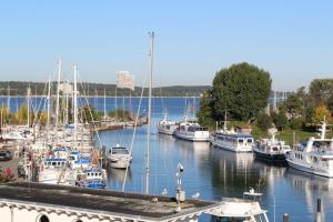 a bunch of boats docked in a harbor at 4Hafenzeiten - Ferienwohnung NIE 7 Vorwärts in Timmendorfer Strand