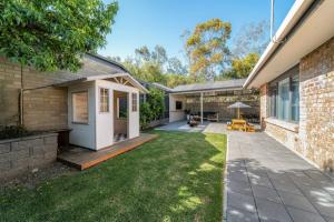 a backyard of a home with a patio at The Grape Escape Location and style on Shiraz Trail in McLaren Vale