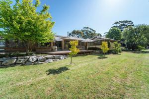 a house with a yard with trees in front of it at The Grape Escape Location and style on Shiraz Trail in McLaren Vale