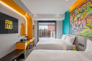 Postel nebo postele na pokoji v ubytování Hotel Mi Rochor