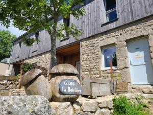 a building with a sign that says glass lab builders at Gites La Boletiere in Saint-Étienne-du-Valdonnez