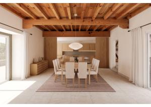 a kitchen and dining room with a table and chairs at Reverence Villas Caldelas in Antas de Ulla