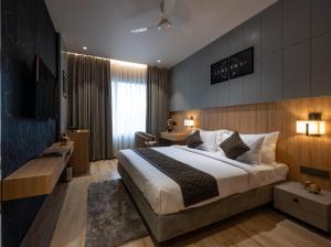 מיטה או מיטות בחדר ב-BUDDHA AVENUE