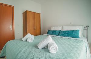 A bed or beds in a room at Basiliki's Apartments