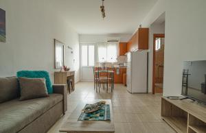 A kitchen or kitchenette at Basiliki's Apartments