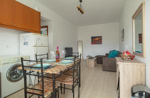 A kitchen or kitchenette at Basiliki's Apartments