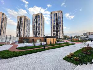 a view of tall buildings in a city at 2-room apartment ЖК Комфорт Сити near MEGA, flat 15 in Almaty
