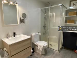 a bathroom with a shower and a toilet and a sink at HomyAT JULIUS in Salamanca