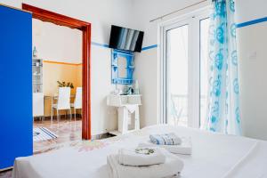 Postel nebo postele na pokoji v ubytování Mavromati Rooms 2