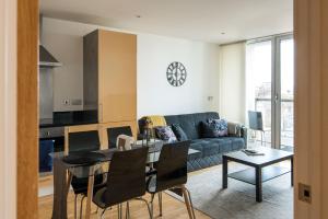 a living room with a couch and a table at Immaculate 1-Bed Apartment in London in London