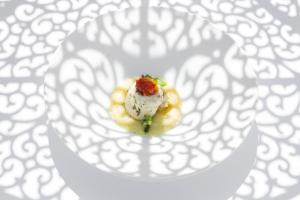 a piece of food on a plate on a table at Miramare E Castello in Ischia