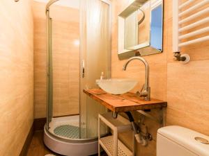 a bathroom with a sink and a shower at Pokoje Gościnne Bryza Gdynia in Gdynia