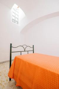 Postel nebo postele na pokoji v ubytování DA NONNA GENEROSA Casa Vacanze