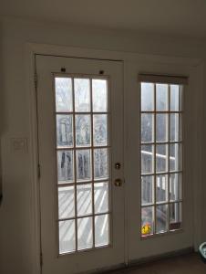 a room with two windows and a door at Bluenose Bed and Breakfast in Halifax