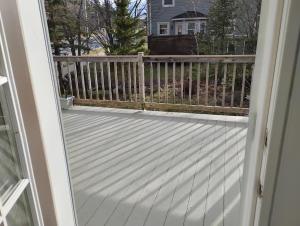 an open door to a deck with a fence at Bluenose Bed and Breakfast in Halifax