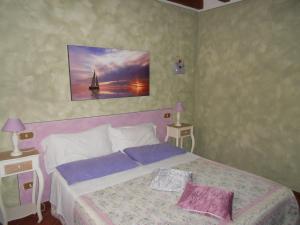 Postel nebo postele na pokoji v ubytování Agriturismo Ai Vigneti