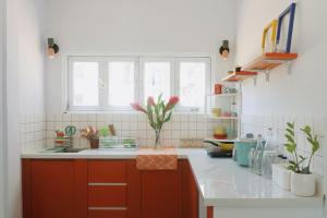 a kitchen with a sink and a counter top at Joie Home in Nha Trang
