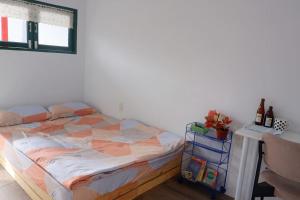 Postel nebo postele na pokoji v ubytování Joie Home