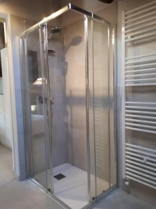 a shower with a glass door in a bathroom at Ca' Santina in Cittadella