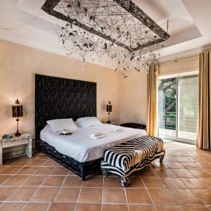 Giường trong phòng chung tại Villa Millennium luxury villa relaxing location