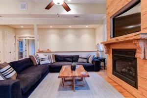 a living room with a couch and a fireplace at Game Room ~ Fire Pit ~ Resort Access ~ Huge Home in Lake Lure
