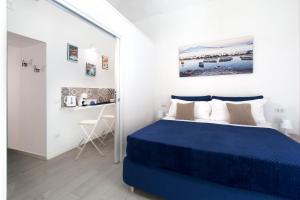Ένα ή περισσότερα κρεβάτια σε δωμάτιο στο YourHome - Jolly Aranci