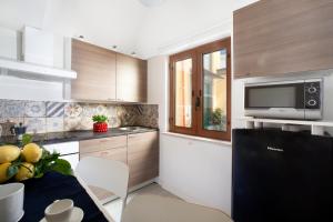 Kuchyň nebo kuchyňský kout v ubytování YourHome - Jolly Aranci