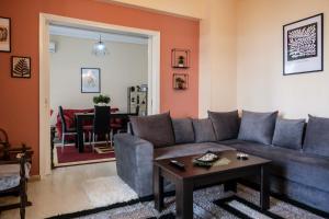 a living room with a couch and a table at sophia's apartment in Volos