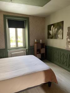 Postel nebo postele na pokoji v ubytování Atipyk'ododo
