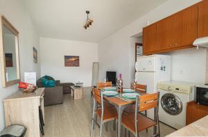 A kitchen or kitchenette at Basiliki's Apartments