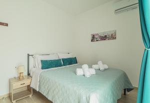 A bed or beds in a room at Basiliki's Apartments