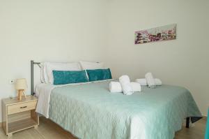 A bed or beds in a room at Basiliki's Apartments