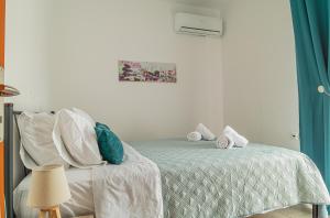 A bed or beds in a room at Basiliki's Apartments
