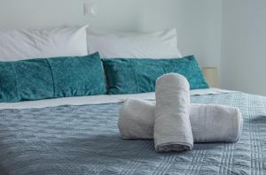 A bed or beds in a room at Basiliki's Apartments