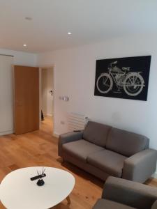 a living room with a couch and a table at Charming 1-Bed Apartment in London in London