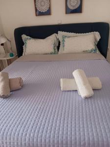 Postel nebo postele na pokoji v ubytování Ilion apartments