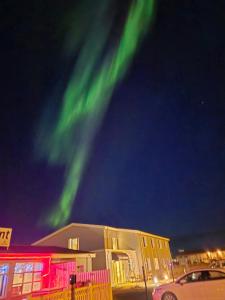 an image of the green northern lights in the sky at Hotel Kanslarinn Hella in Hella