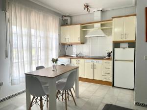 Kuchyň nebo kuchyňský kout v ubytování Apartamento Columela