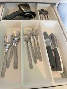 a drawer filled with utensils in a box at G23 in Sarpsborg