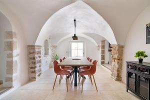 a dining room with a table and chairs at Évasion de charme, maison authentique et spa privé in La Baume-de-Transit