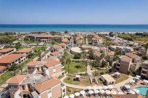 an aerial view of a resort with the ocean at Caldera Beach in Platanias